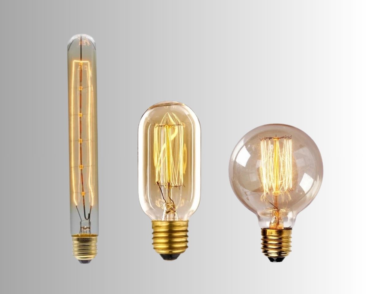 3 ampoules Edison à filament de différentes tailles, sur fond gris